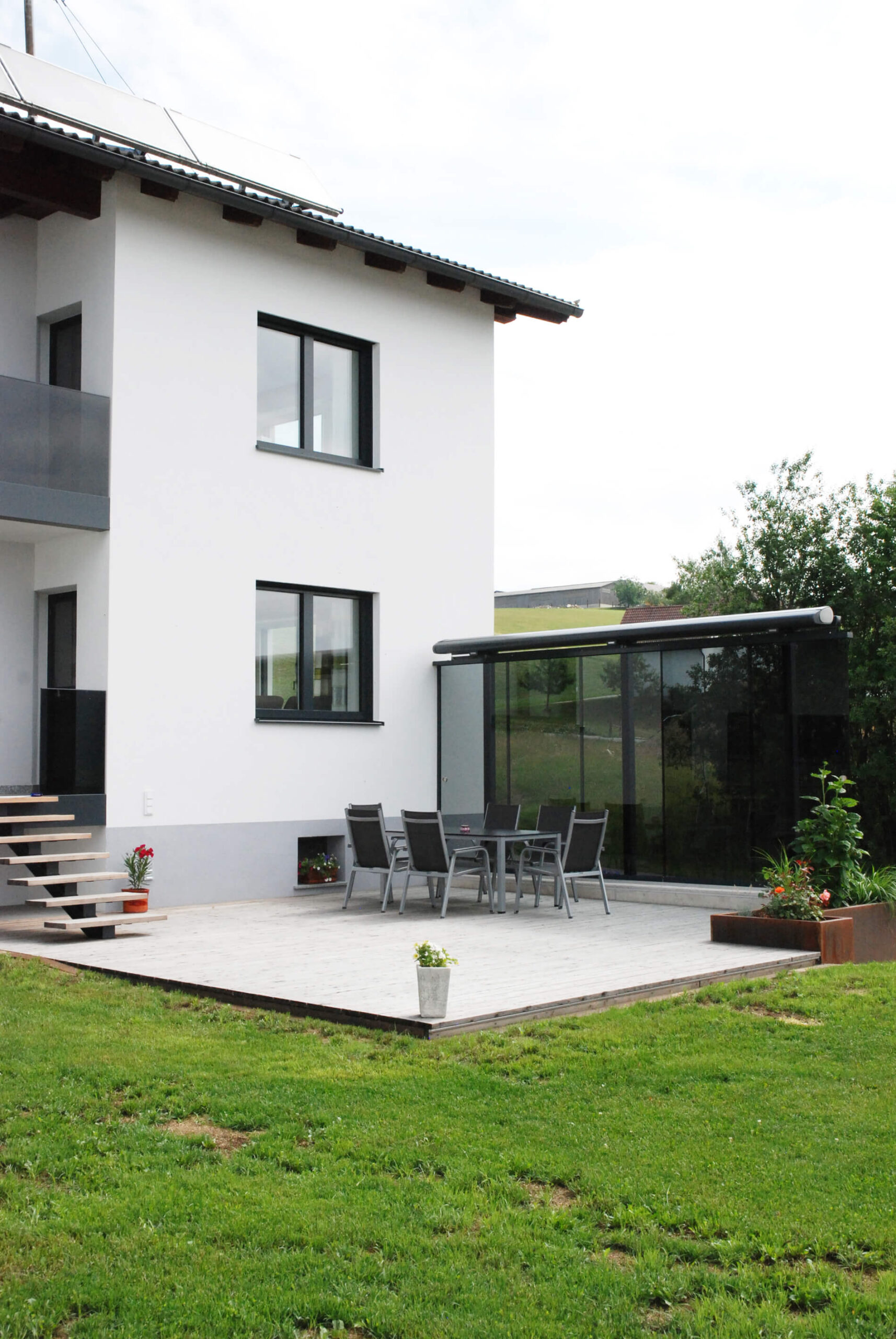 schiebbarer Windschutz aus Glas für Terrassen